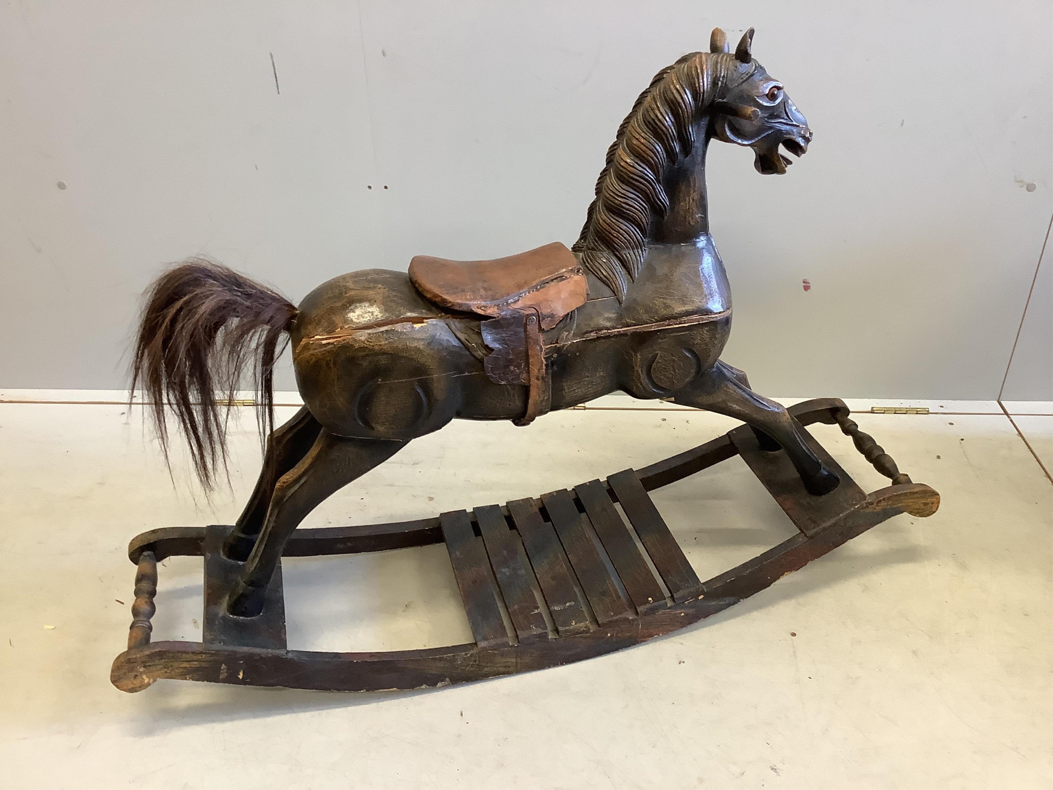 A French 19th century style child’s carved wood rocking horse, length 118cm, height 82cm. Condition - poor